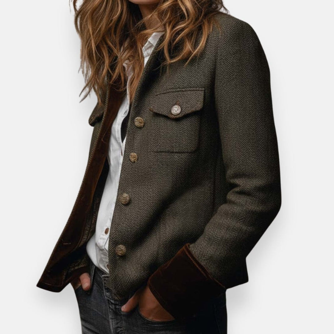 Olive herringbone military jacket with epaulet, flap pocket, and brass buttons