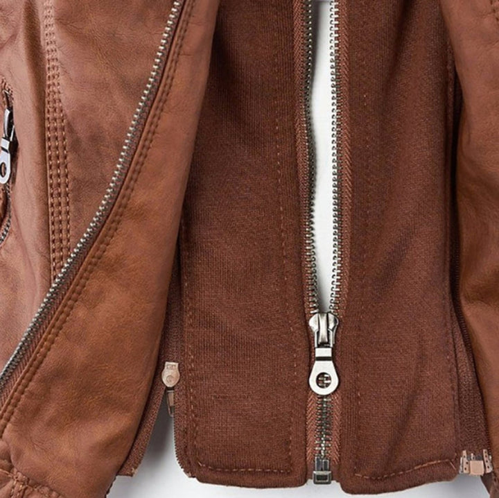 Brown biker jacket close-up: front zippers and stitched seams on placket
