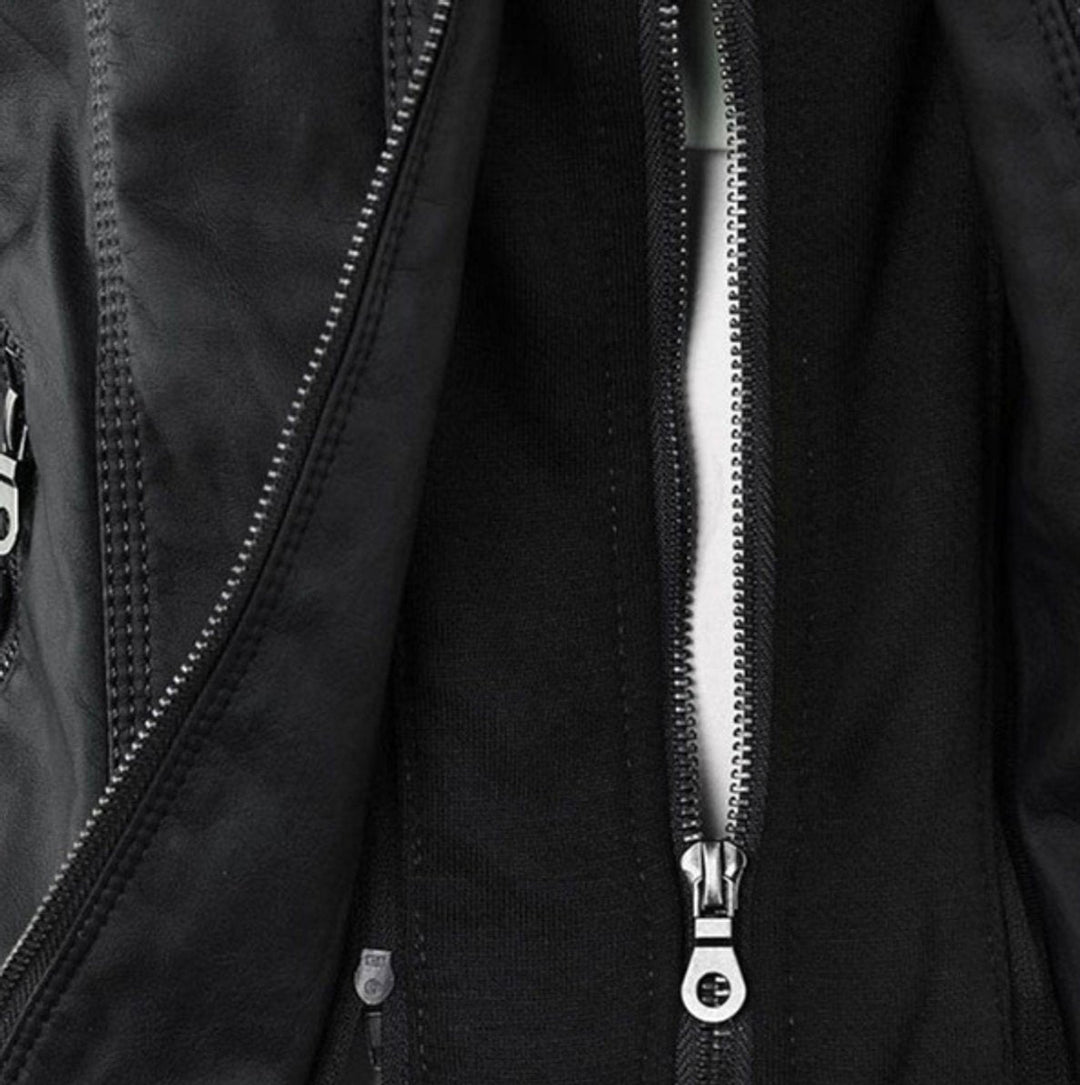 Black zip-up biker jacket front detail with metal zipper pull