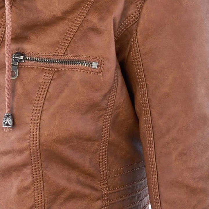Brown biker jacket close-up: zip pocket with metal zipper and contrast stitching
