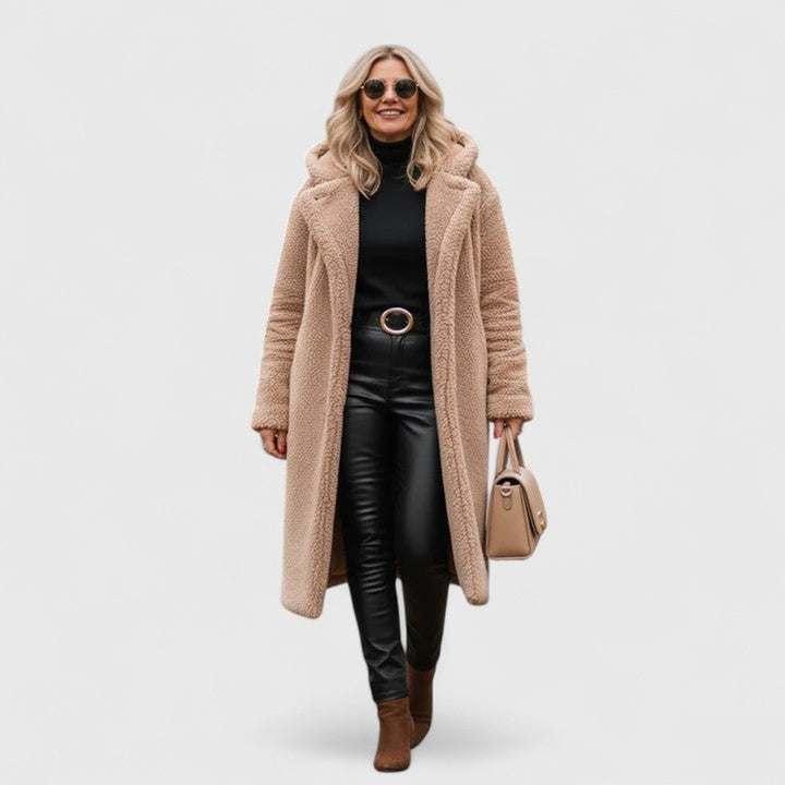 Beige long hooded winter coat with fuzzy texture, open front and front pockets.