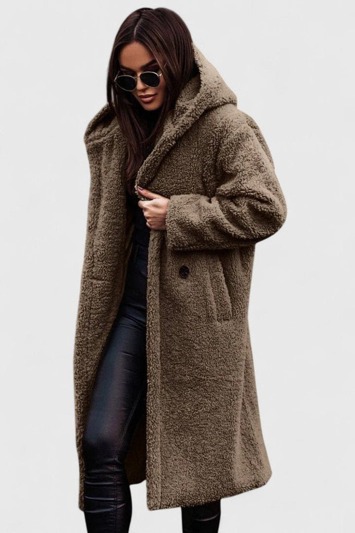 Light taupe long hooded winter coat with fuzzy texture, button front and front pockets.