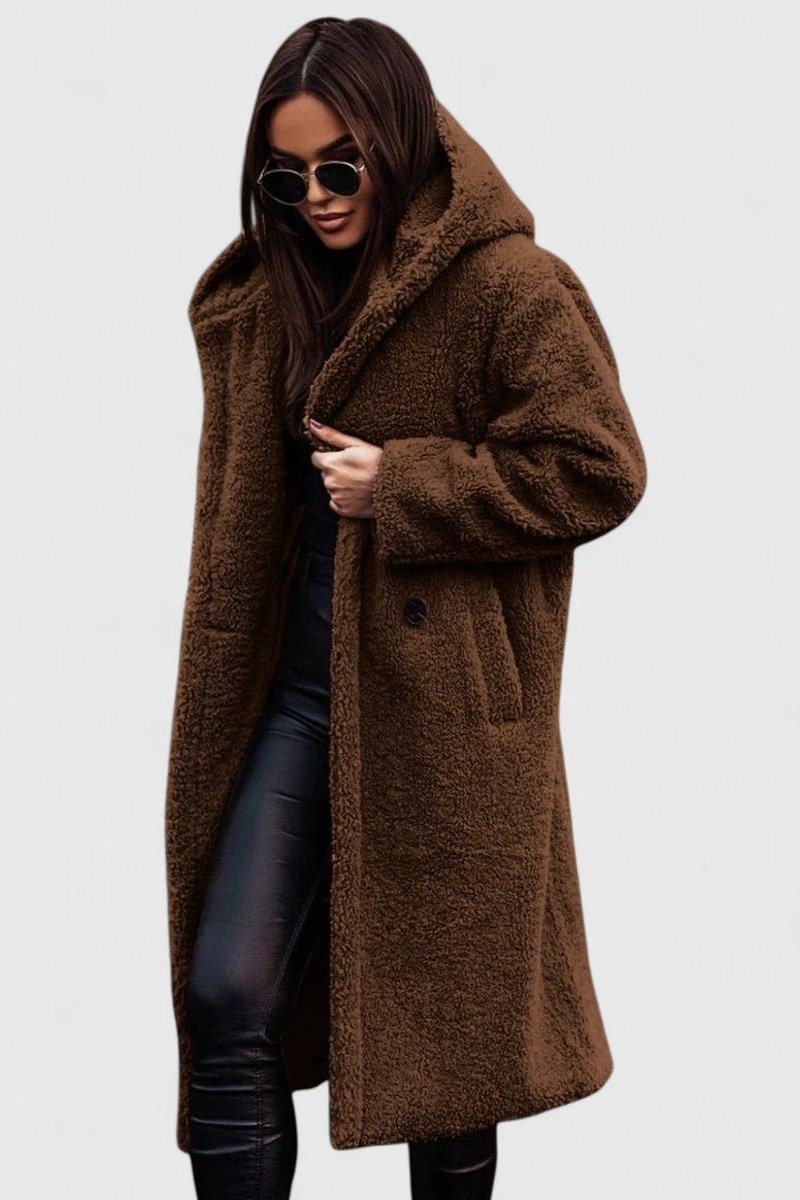Brown long hooded winter coat with fuzzy texture, button front and side pockets.