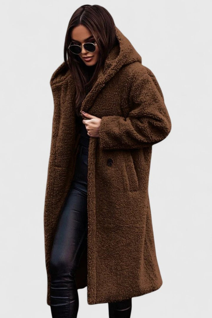 Brown long hooded winter coat with fuzzy texture, button front and side pockets.