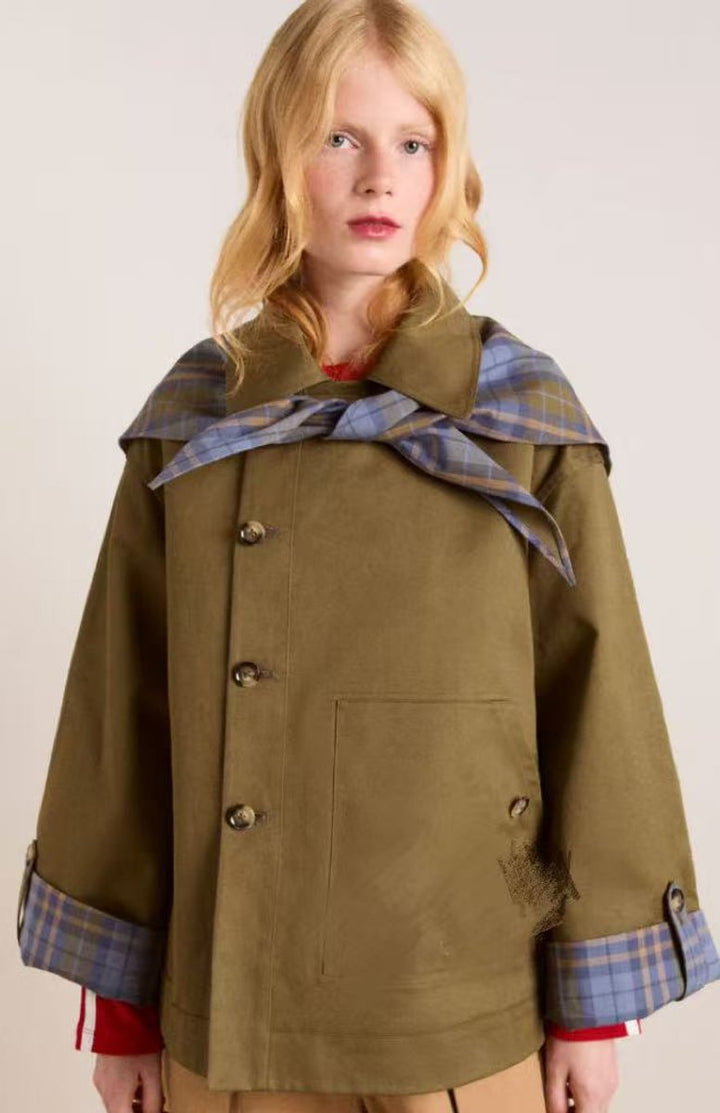 Oversized short jacket in olive-brown canvas with double-button front and plaid details