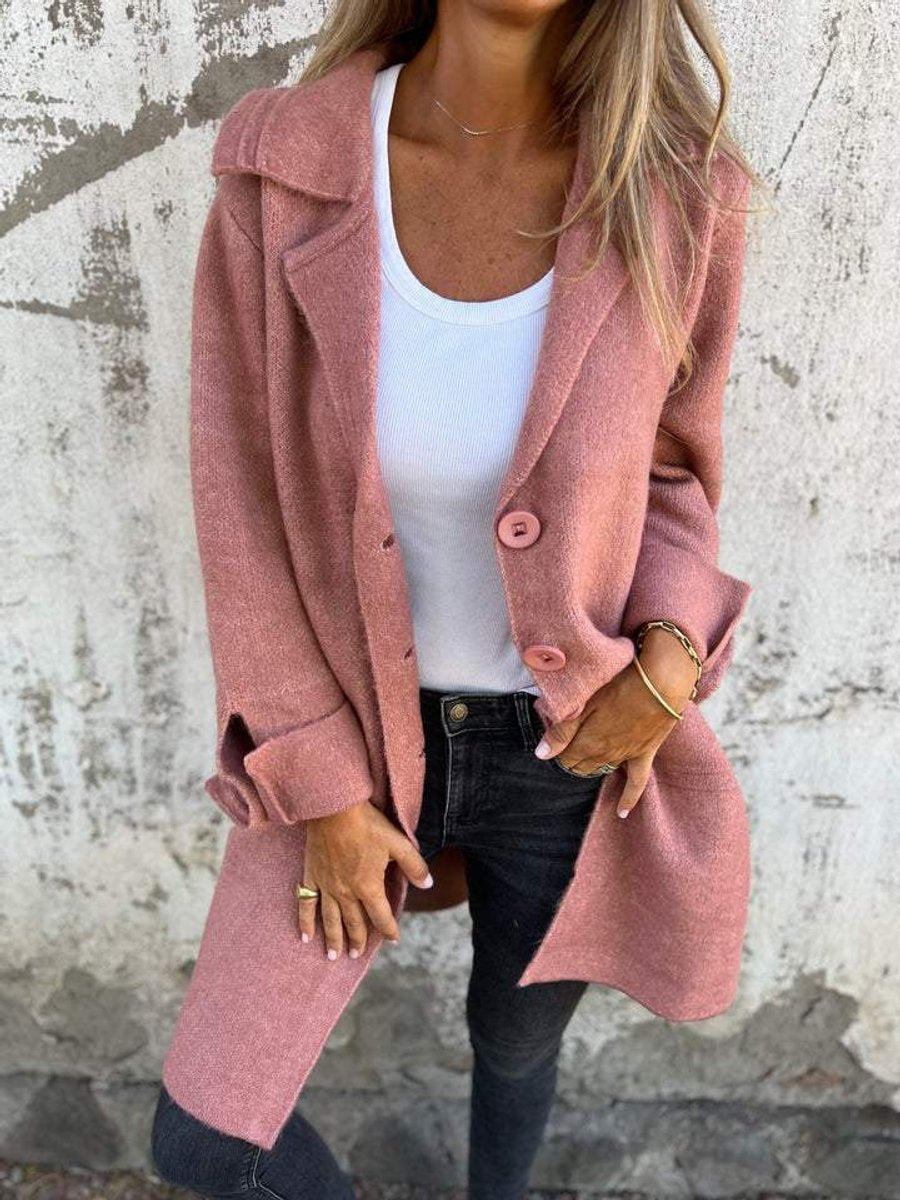 Dusty pink long coat with lapel collar, button front, long sleeves, side pockets.
