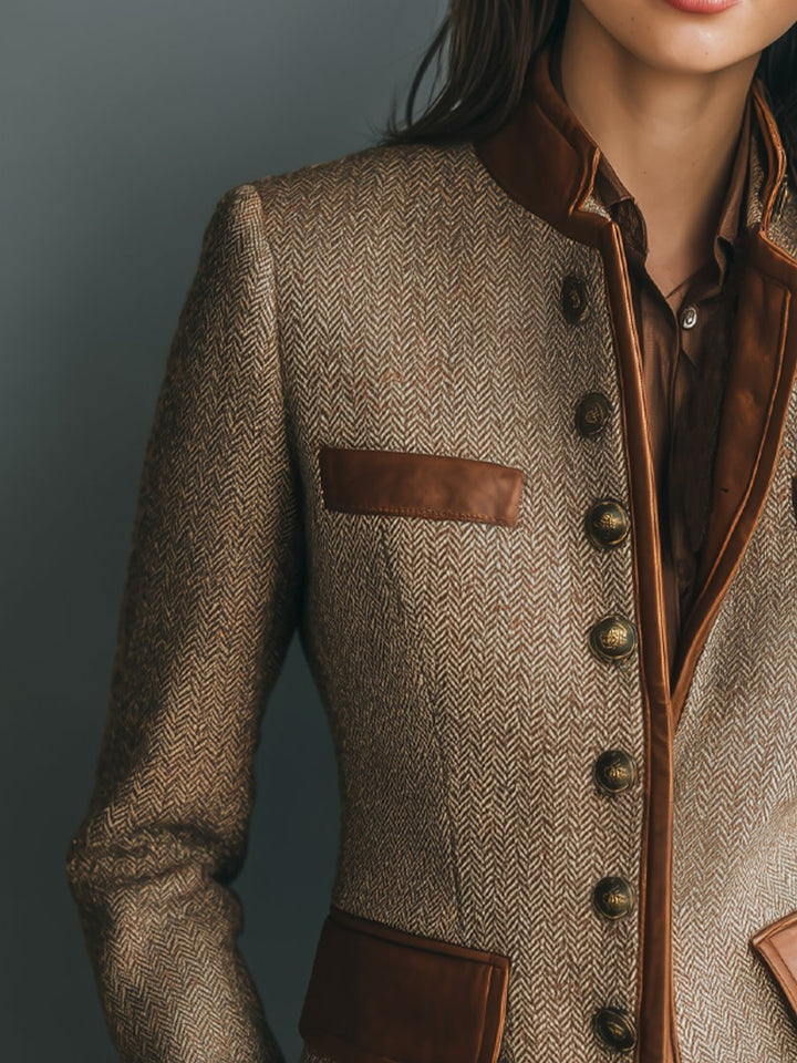 Brown herringbone blazer with brown leather patch pocket and dark button front
