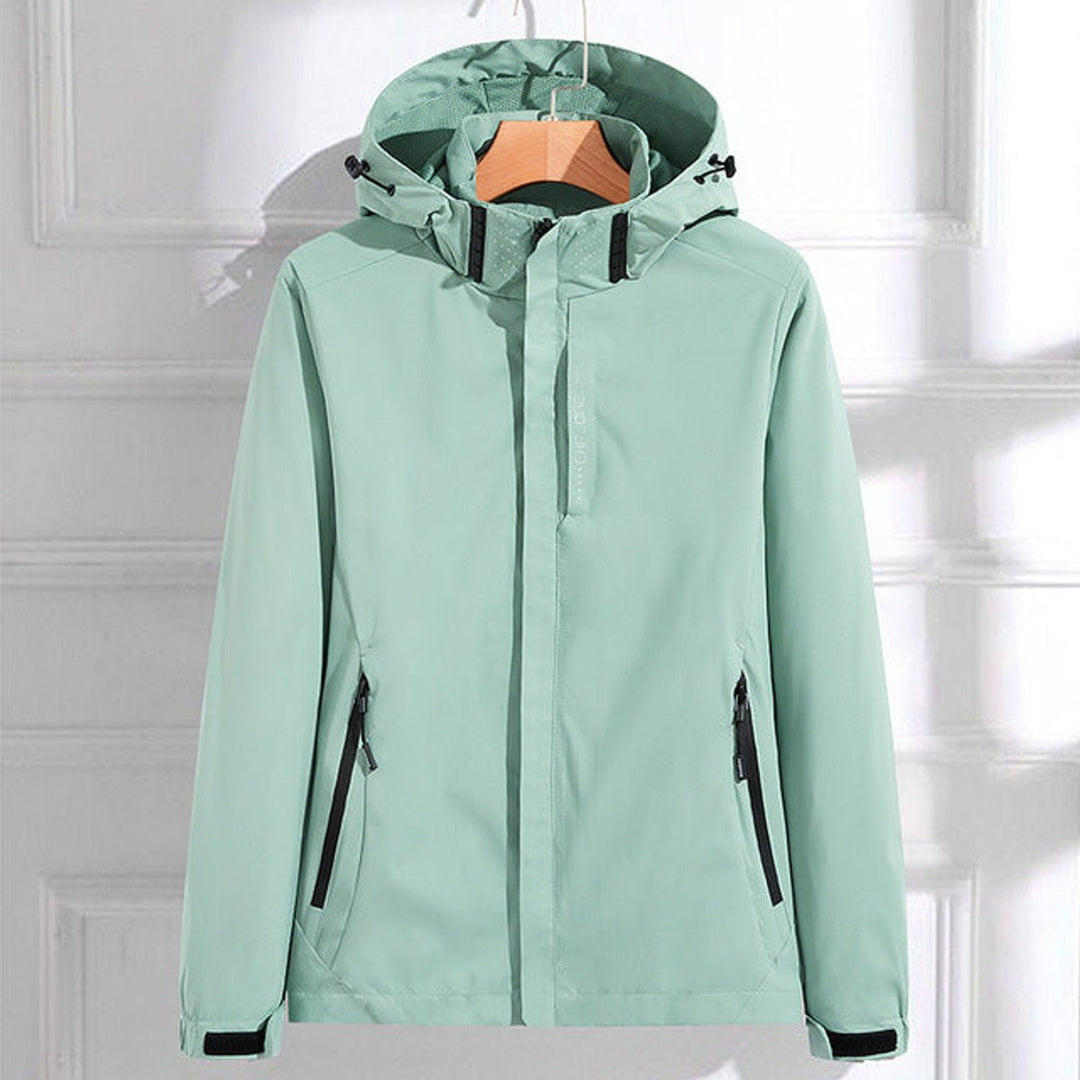 Mint green waterproof rain jacket with hood, front zipper, and side pockets.